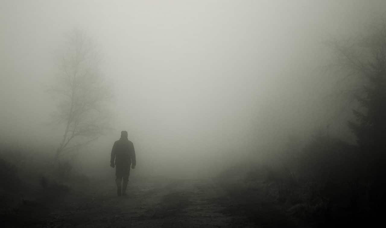 Person walking in thick fog