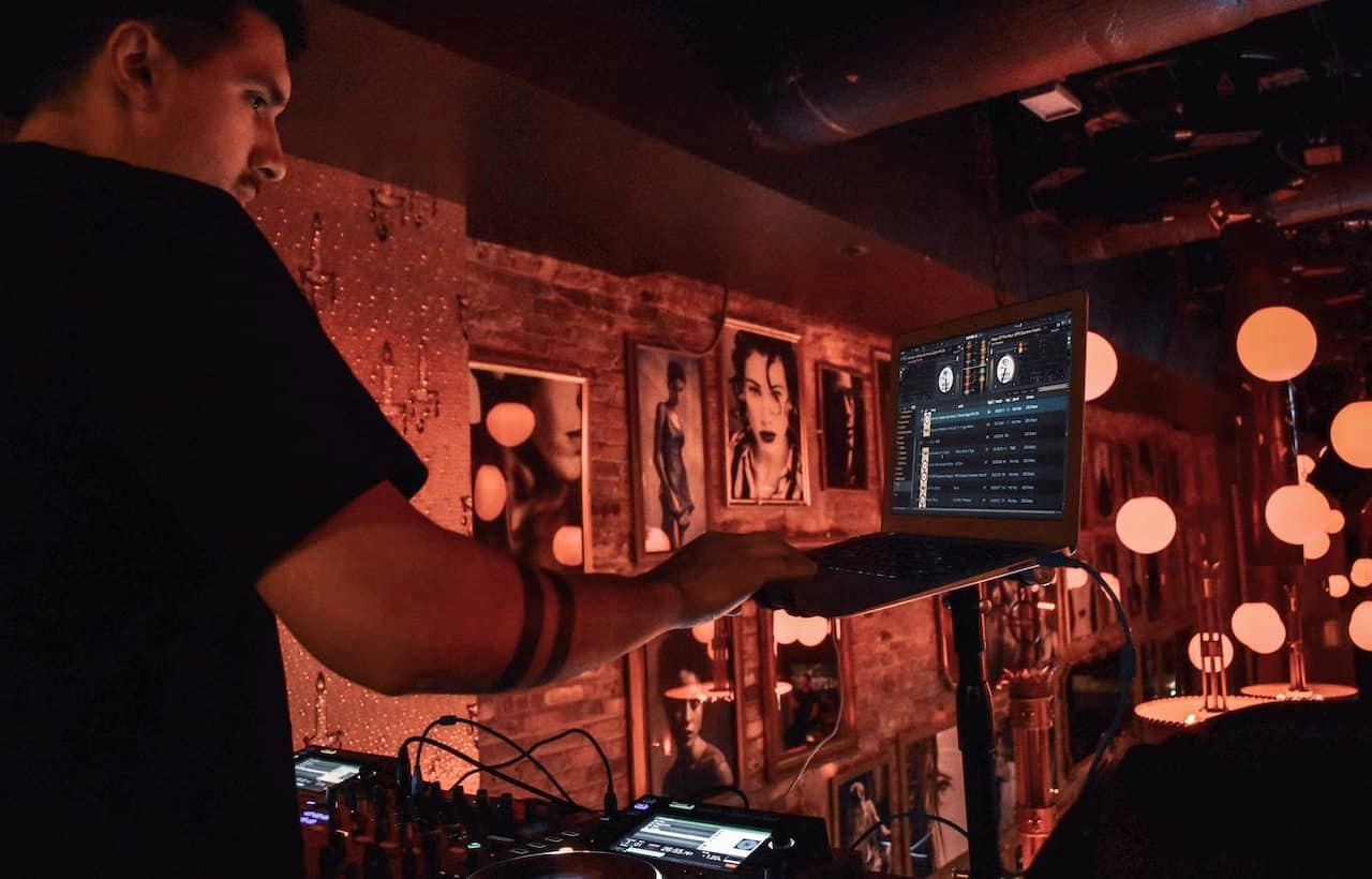 Man working in a bar at night