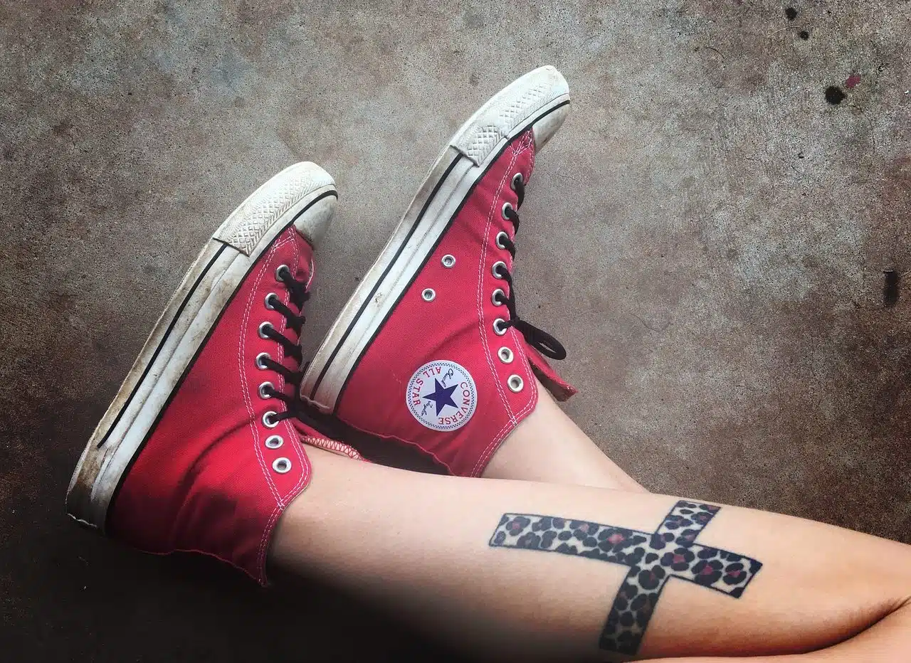 Cross tattoo on a leg