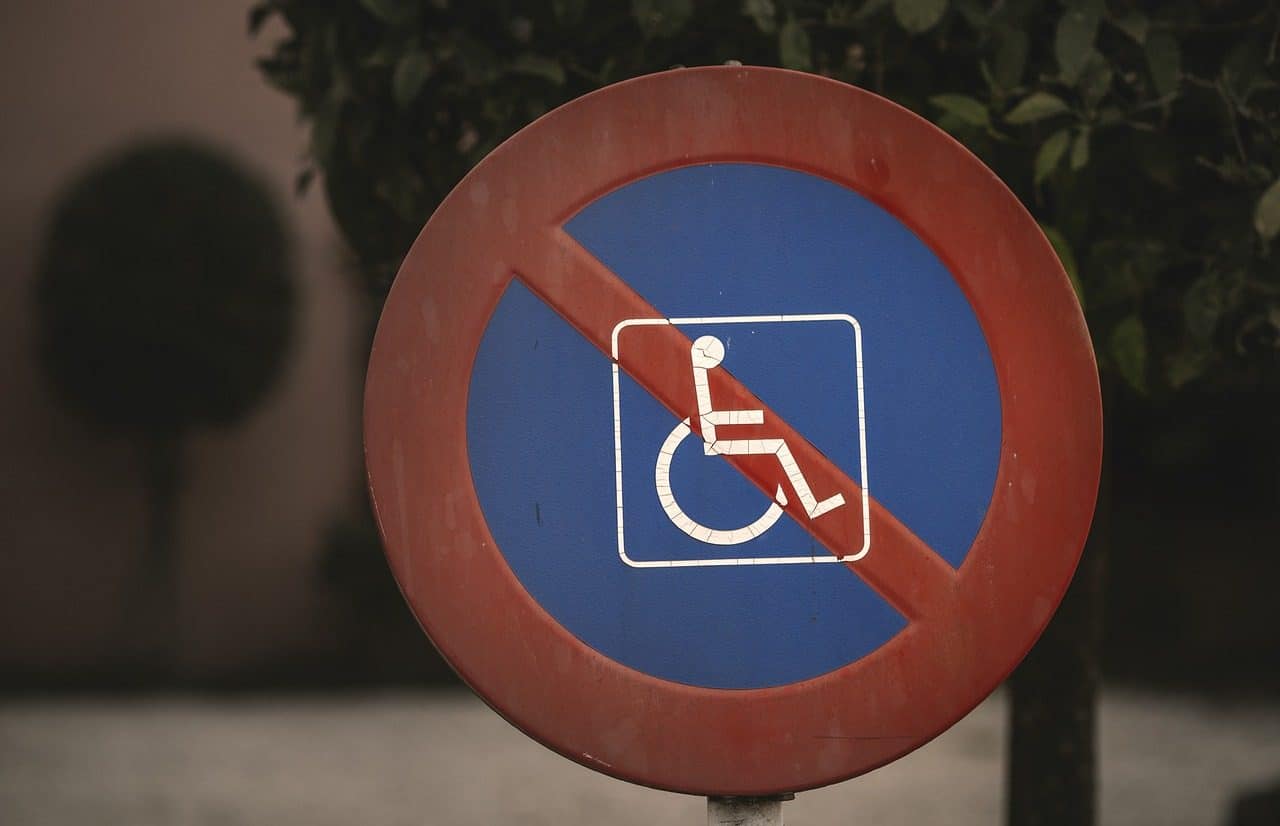 No parking sign with an icon of a person in a wheelchair