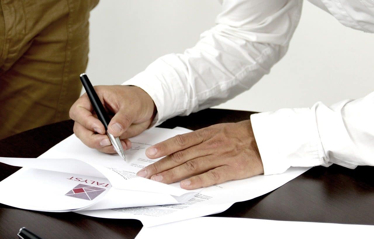 Man signing a legal document