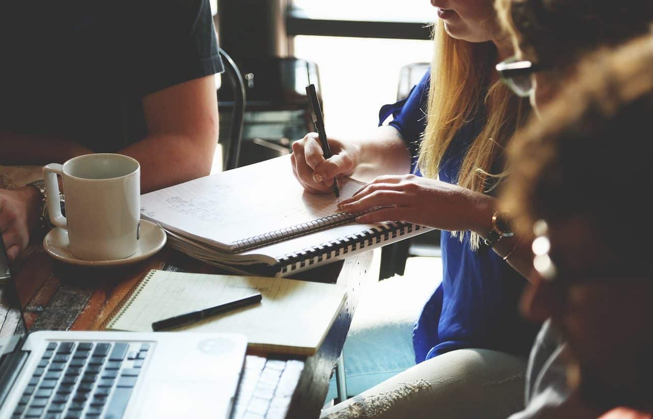 People working with computers and notebooks