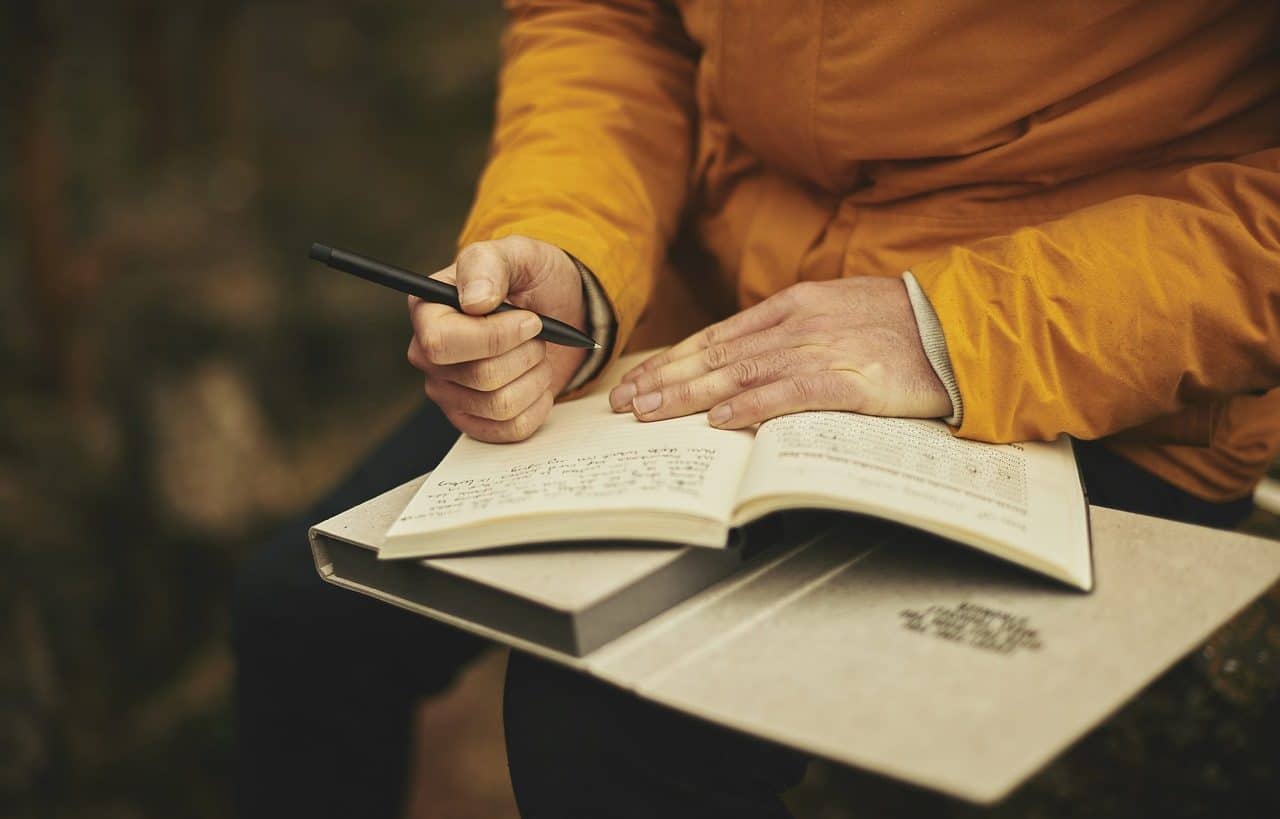 Person writing a personal diary