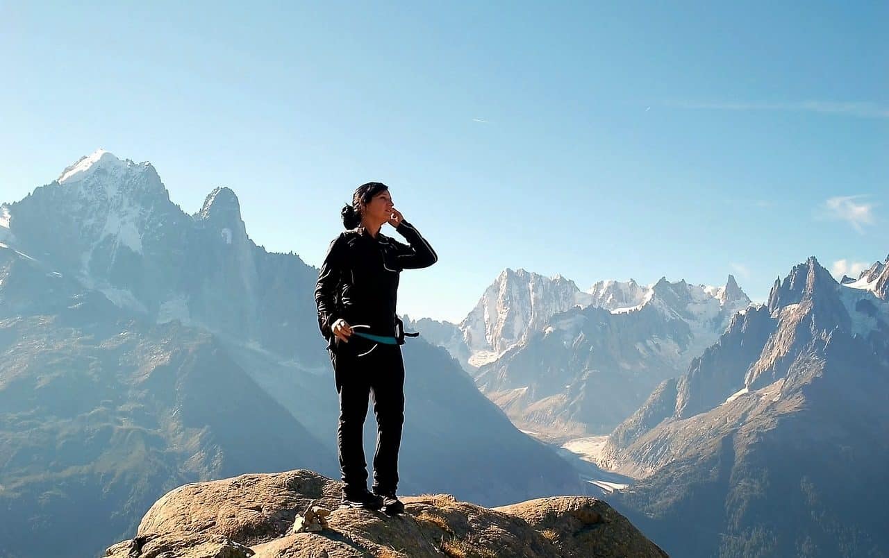 Woman on top of a mountain