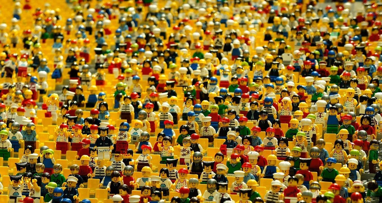 Many lego figures on a yellow background