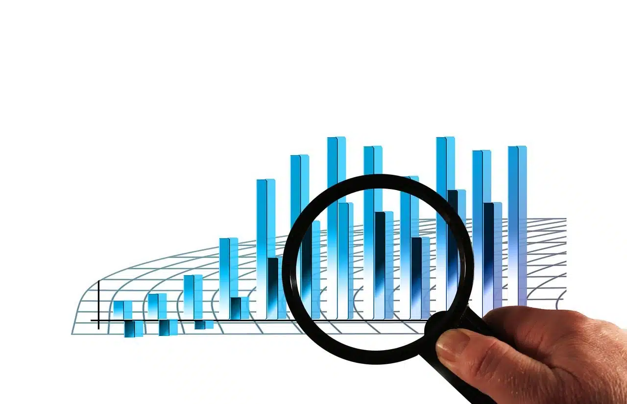 Person examining a statistical graph with a magnifying glass