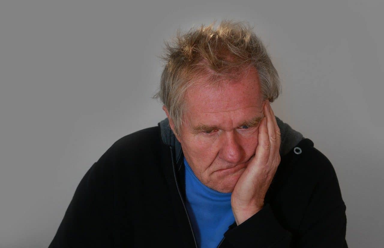 Man resting his head on his hand