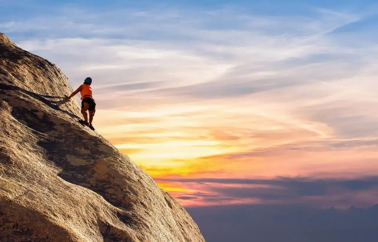 Mountaineer looking at the sunset