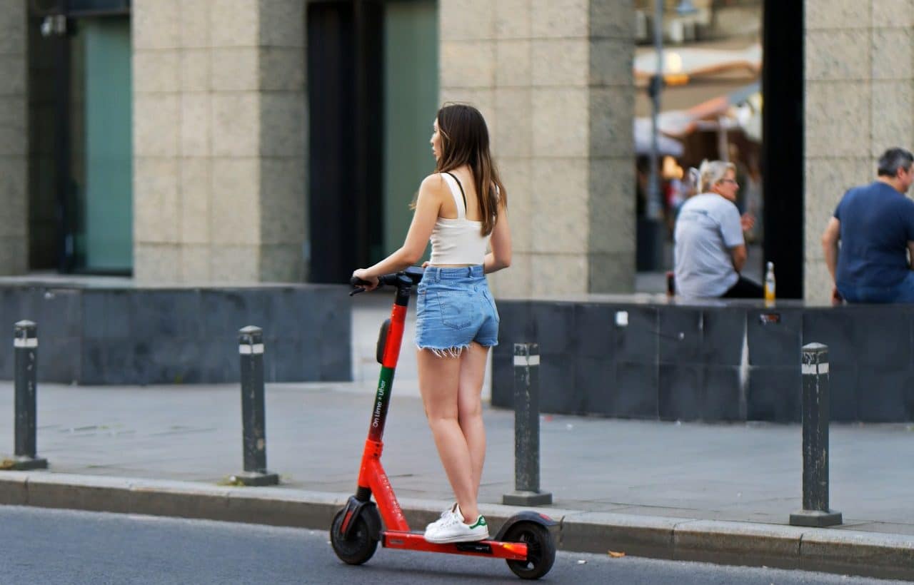 Woman using electric scooter