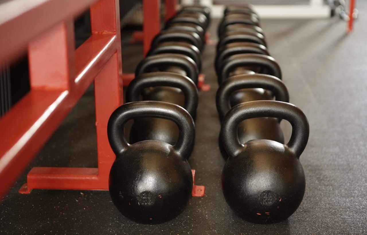 Several kettlebells arranged in the gym