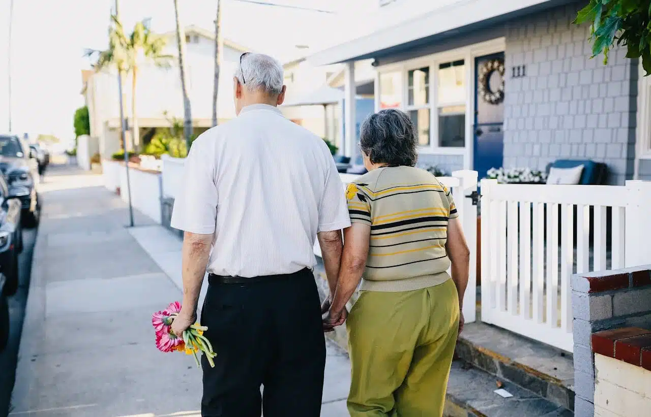 Elderly man and woman walking on the street