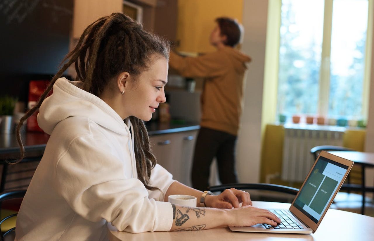 Woman working on her laptop from home