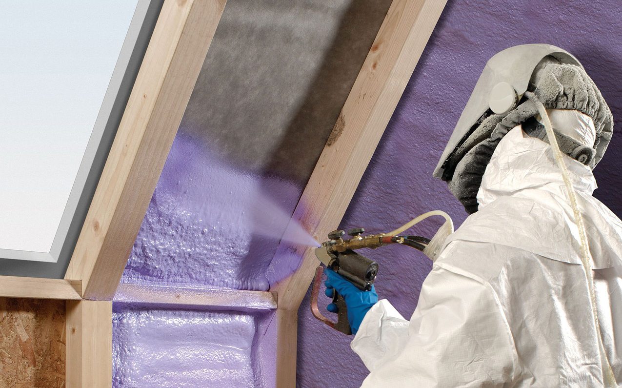 Person painting a thermally insulated wall.