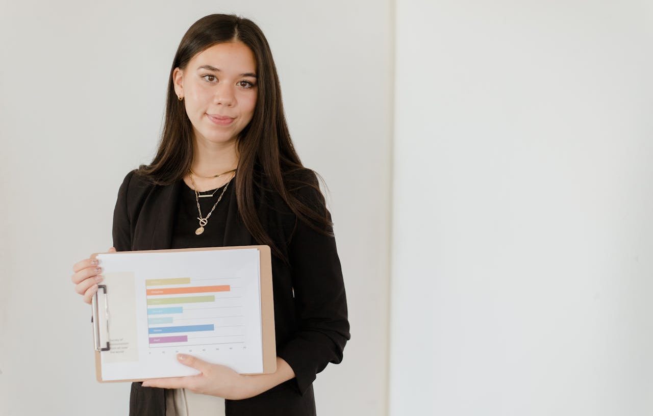 Woman holding a bar graph