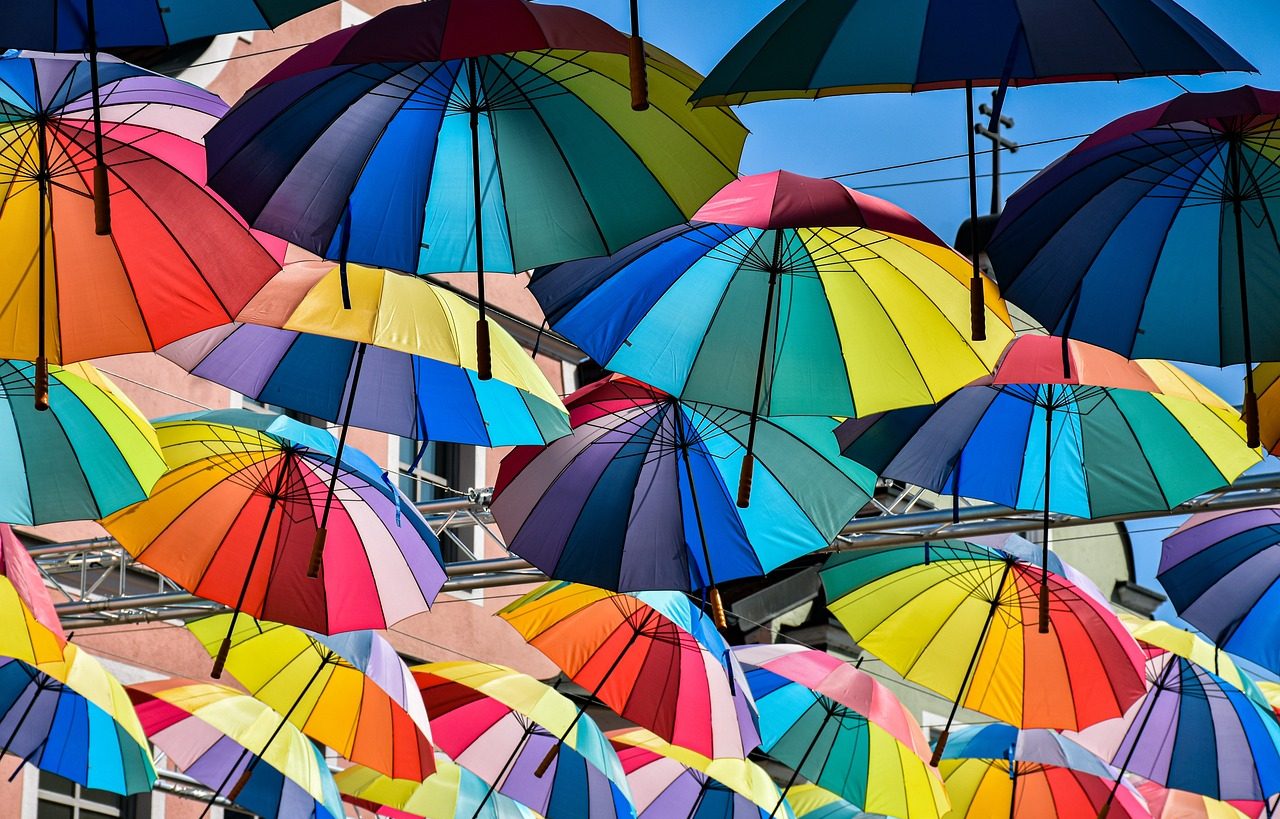 Many umbrellas with rainbow colors.