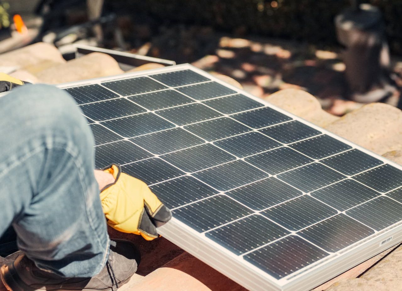 Man installing solar panel