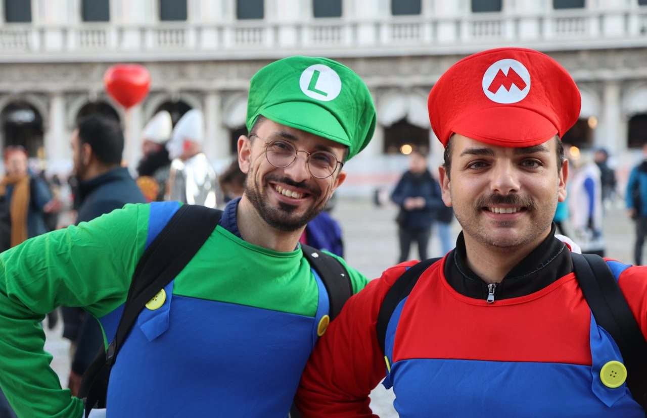 Two young people dressed as Mario and Luigi