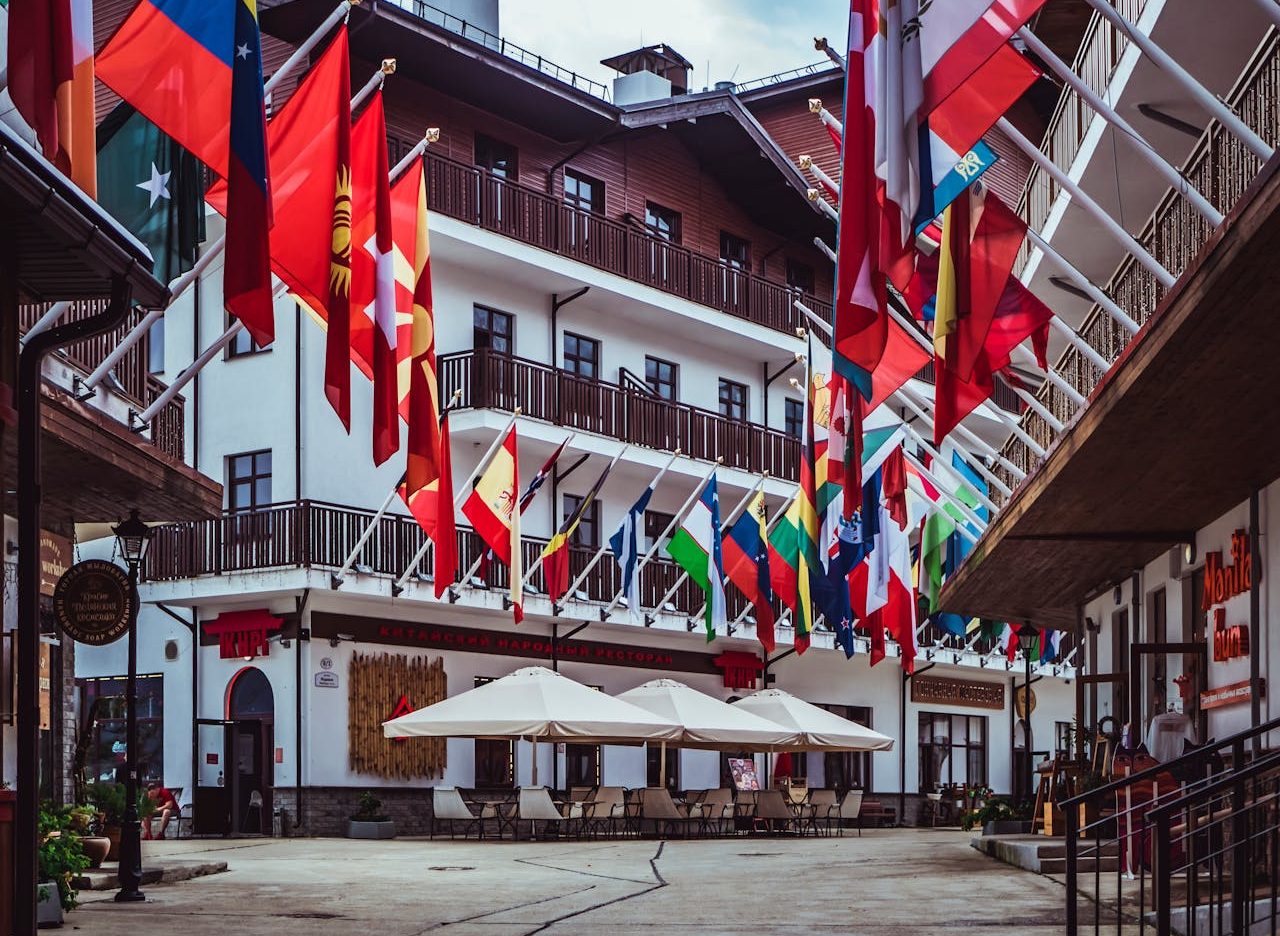 Flags of different countries in front of a building